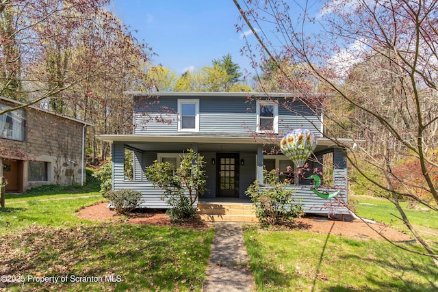675 Apple Tree Rd, Harding, PA 18643 - view of front of home with covered porch, a front lawn, and a chimney