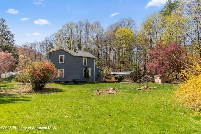 675 Apple Tree Rd, Harding, PA 18643 - view of green lawn with a storage shed