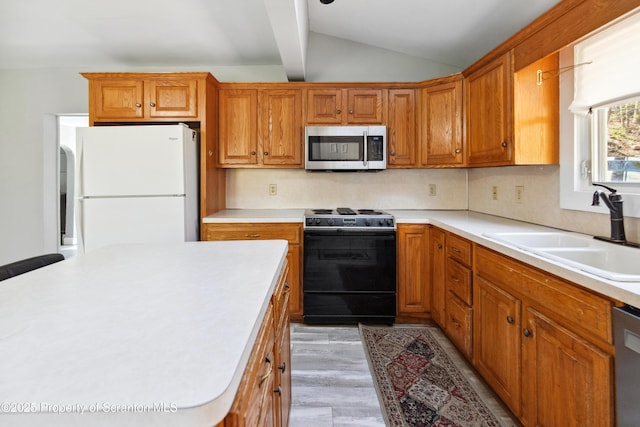 675 Apple Tree Rd, Harding, PA 18643 - kitchen featuring stainless steel appliances, light countertops, brown cabinets, and light wood finished floors