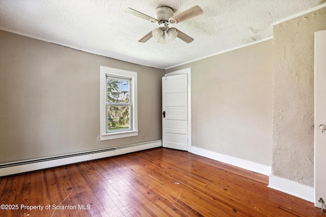675 Apple Tree Rd, Harding, PA 18643 - empty room with a textured ceiling, baseboard heating, hardwood / wood-style flooring, ceiling fan, and ornamental molding