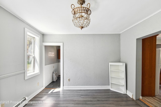 675 Apple Tree Rd, Harding, PA 18643 - spare room with a baseboard heating unit, wood finished floors, radiator, a chandelier, and crown molding