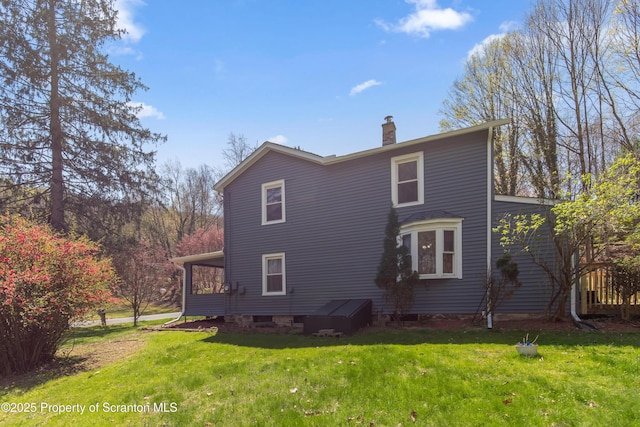 675 Apple Tree Rd, Harding, PA 18643 - view of side of home featuring a chimney and a yard