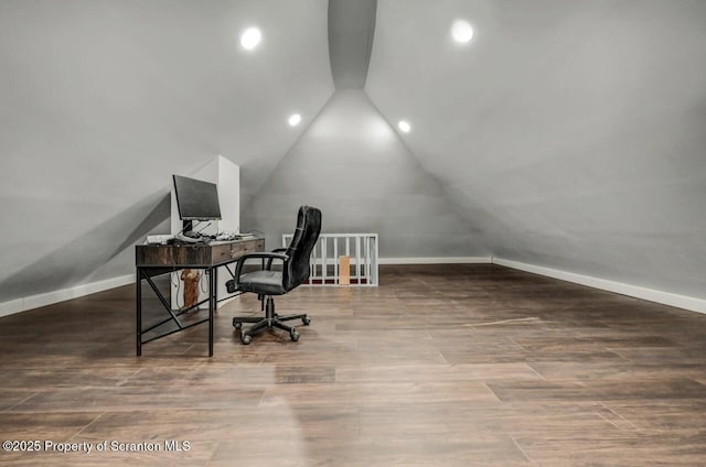 office featuring lofted ceiling, recessed lighting, wood finished floors, and baseboards