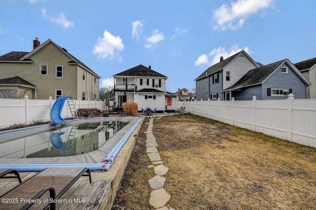 view of yard with a fenced backyard and an outdoor structure