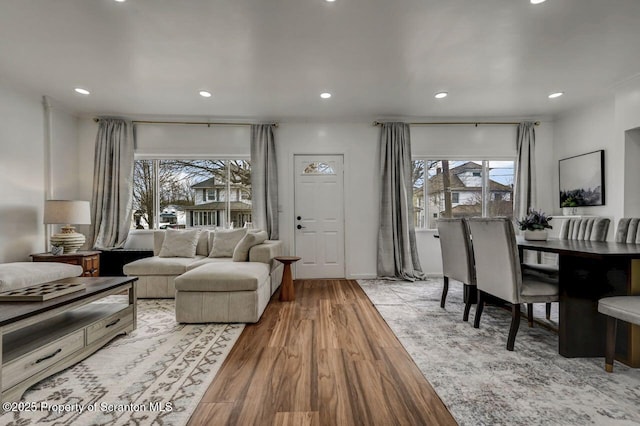 living area featuring light wood finished floors and recessed lighting