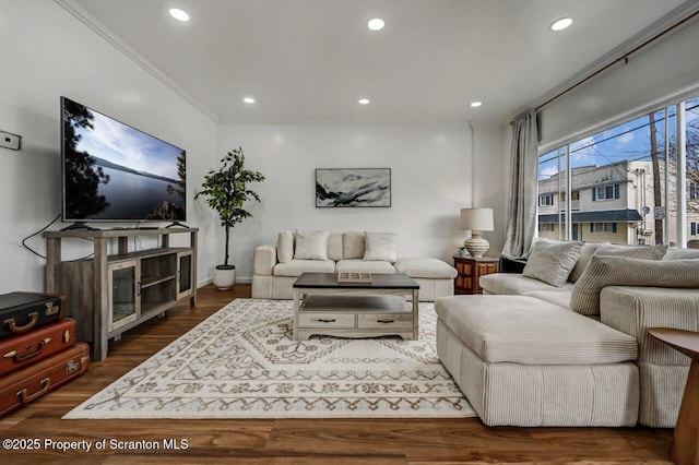 living room featuring recessed lighting, wood finished floors, and crown molding