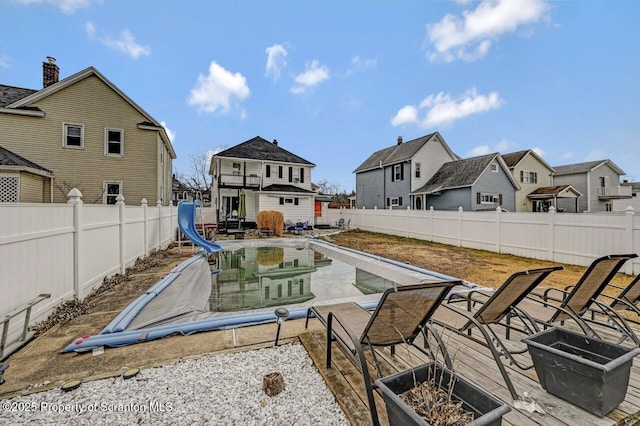 view of patio / terrace with a fenced backyard and a residential view