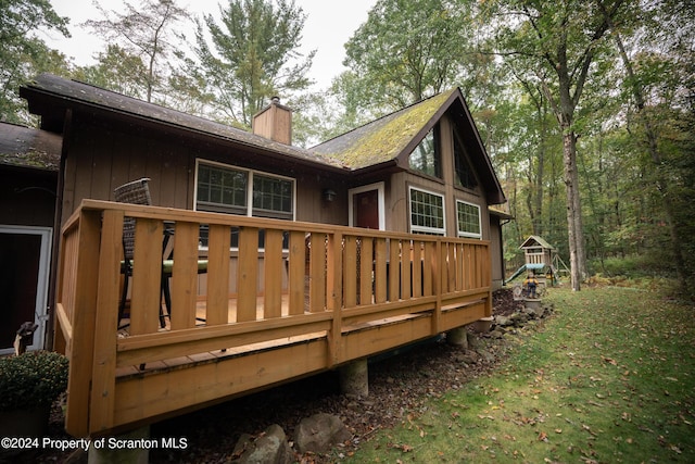 rear view of house with a wooden deck