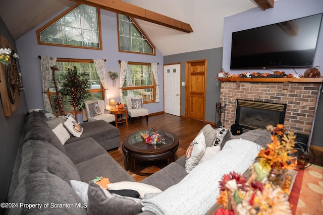 living room featuring beam ceiling, a fireplace, dark hardwood / wood-style flooring, and high vaulted ceiling