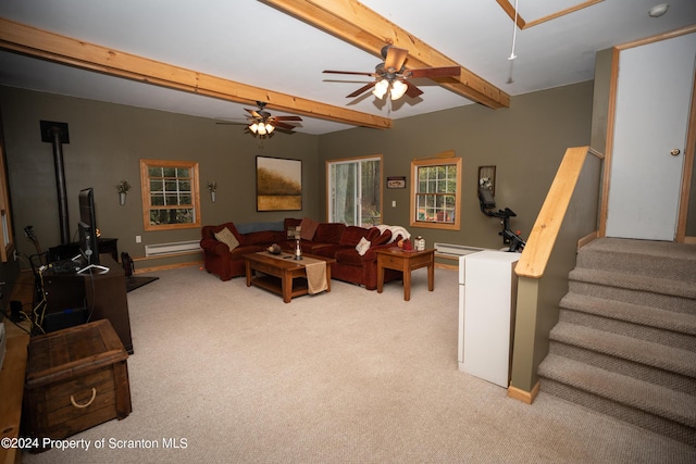 carpeted living room with ceiling fan, beamed ceiling, and a baseboard radiator