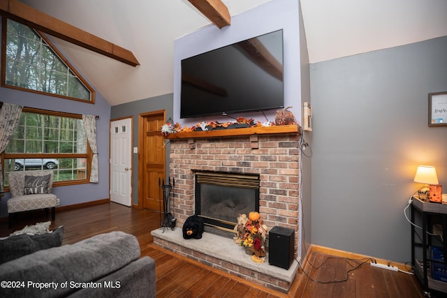 living room with beam ceiling, a fireplace, high vaulted ceiling, and dark wood-type flooring