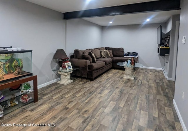 living room with hardwood / wood-style flooring and beam ceiling