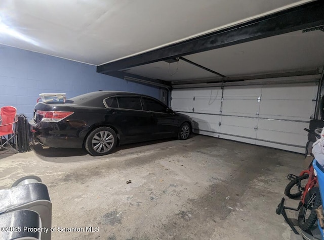 garage featuring a carport