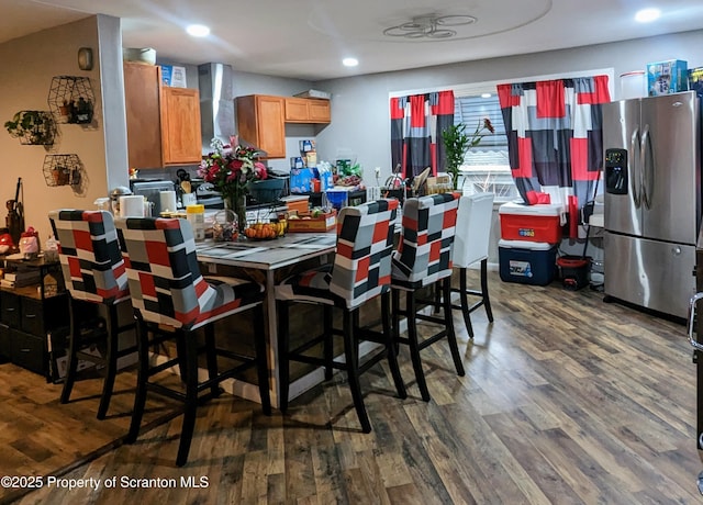 dining space with dark hardwood / wood-style floors