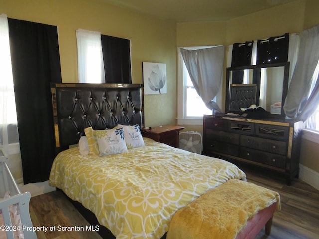 bedroom featuring dark wood-type flooring