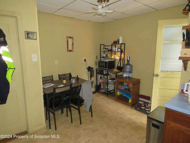 dining room featuring a drop ceiling and ceiling fan