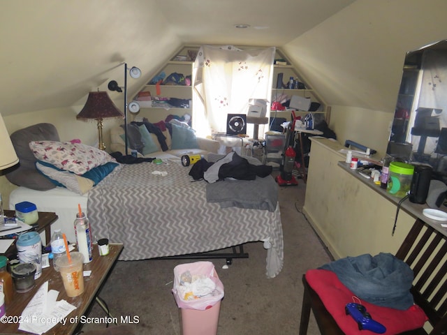 bedroom featuring carpet floors and vaulted ceiling