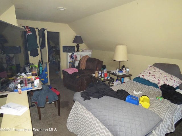 bedroom featuring carpet flooring and vaulted ceiling