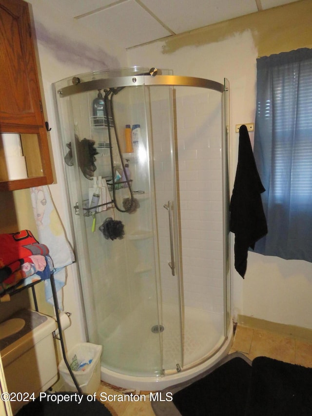 bathroom featuring tile patterned flooring and walk in shower