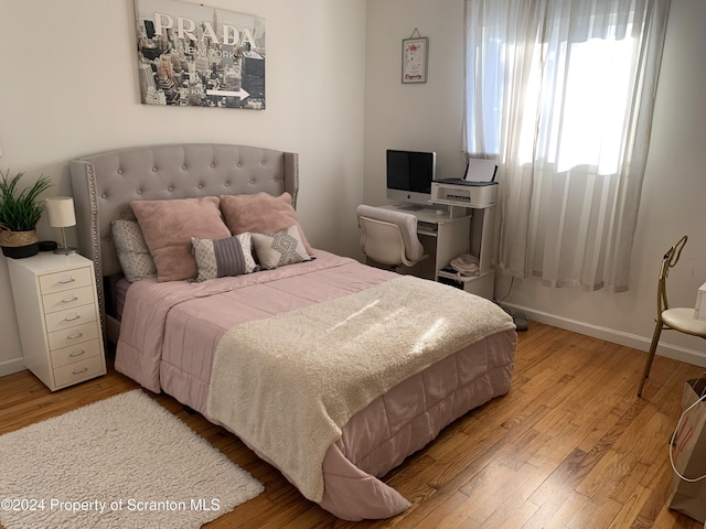 bedroom featuring light wood-type flooring