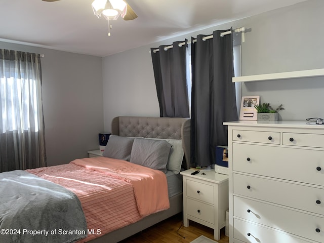 bedroom featuring hardwood / wood-style floors and ceiling fan