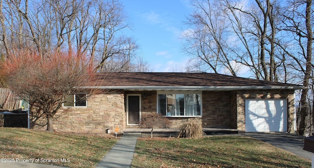 view of front facade with a garage and a front lawn