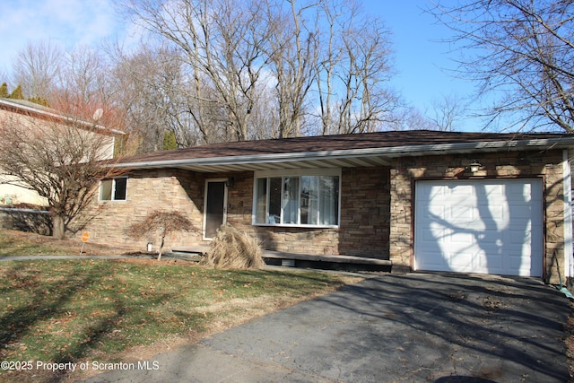 view of front of property with a front lawn and a garage