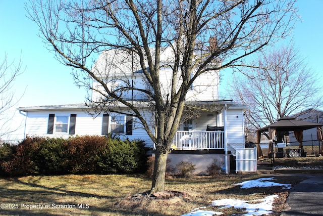 view of front facade with a porch and a gazebo