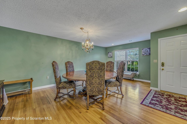 33 Hedge Row Run, Clarks Summit, PA 18411 - dining area with light wood finished floors, a textured ceiling, and a chandelier