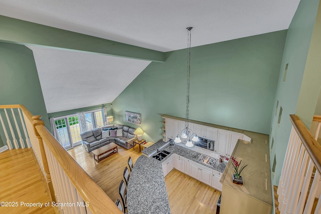 33 Hedge Row Run, Clarks Summit, PA 18411 - living area featuring light wood-type flooring, beamed ceiling, and high vaulted ceiling