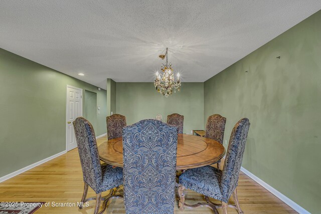 33 Hedge Row Run, Clarks Summit, PA 18411 - dining room featuring light wood-style flooring, a chandelier, a textured ceiling, and recessed lighting
