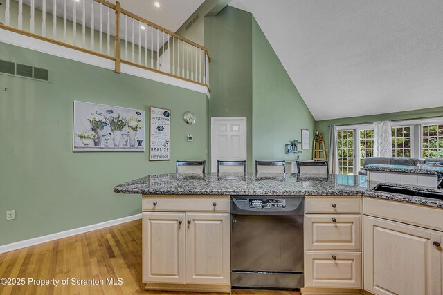 33 Hedge Row Run, Clarks Summit, PA 18411 - kitchen with high vaulted ceiling, dishwasher, light brown cabinetry, light wood finished floors, and stone countertops