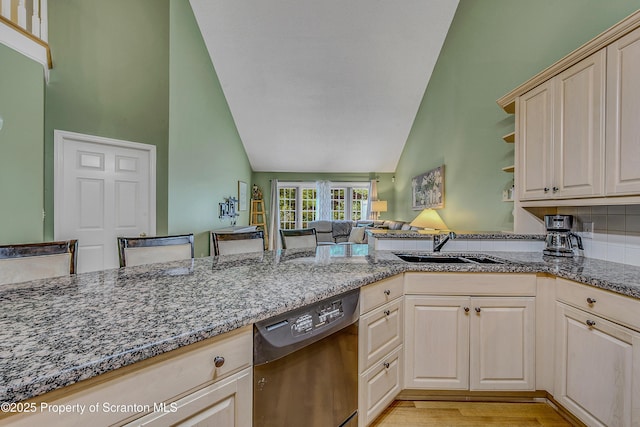 33 Hedge Row Run, Clarks Summit, PA 18411 - kitchen featuring stainless steel dishwasher, dark stone counters, light wood-style floors, high vaulted ceiling, and open shelves