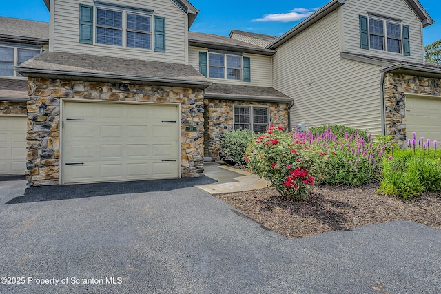 33 Hedge Row Run, Clarks Summit, PA 18411 - view of front of home featuring stone siding, a garage, and driveway