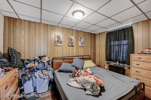 401-405 S Main Ave, Scranton, PA 18504 - bedroom featuring wood finished floors, wood walls, and a drop ceiling