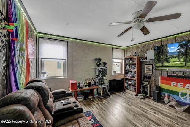 401-405 S Main Ave, Scranton, PA 18504 - living area with a ceiling fan, wood finished floors, and brick wall