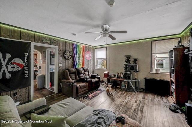 401-405 S Main Ave, Scranton, PA 18504 - living room featuring brick wall, a ceiling fan, and wood finished floors