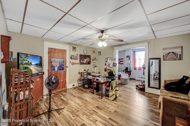 401-405 S Main Ave, Scranton, PA 18504 - dining area with wood finished floors, a ceiling fan, a baseboard heating unit, and a drop ceiling