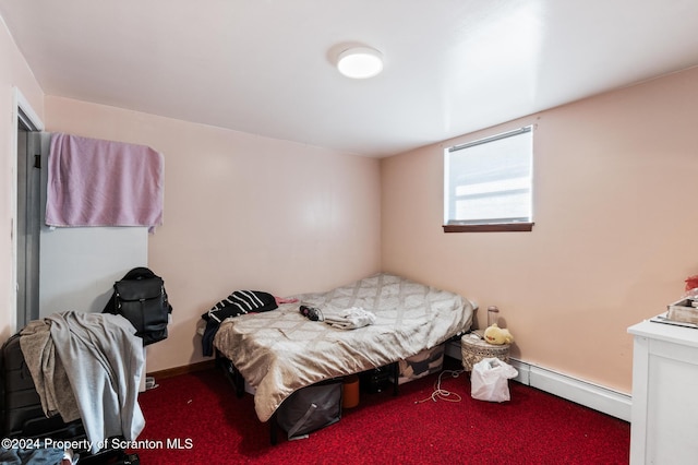 bedroom featuring carpet flooring and baseboard heating