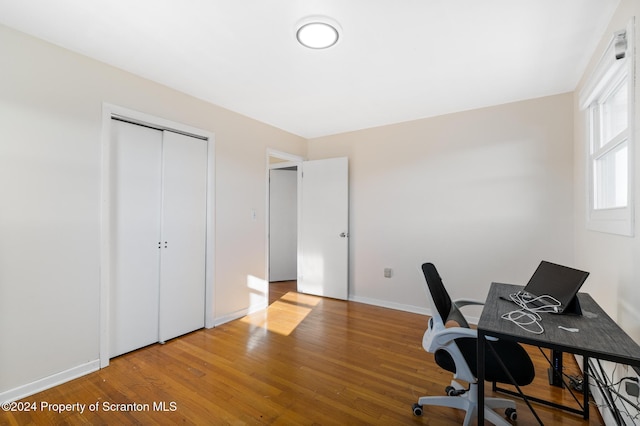 office area with wood-type flooring