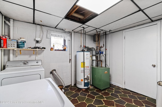 laundry room with gas water heater and washer / dryer