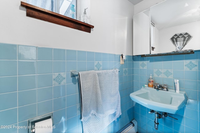 bathroom with sink and tile walls