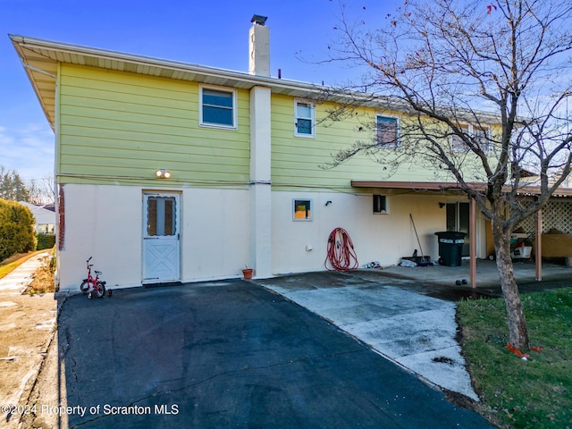 rear view of property featuring a patio area