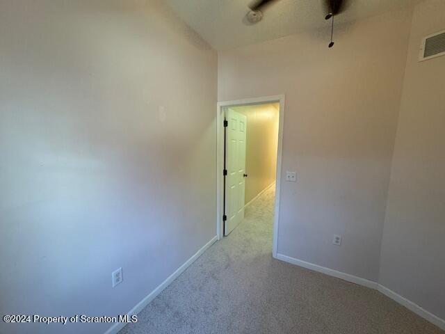 unfurnished room with ceiling fan