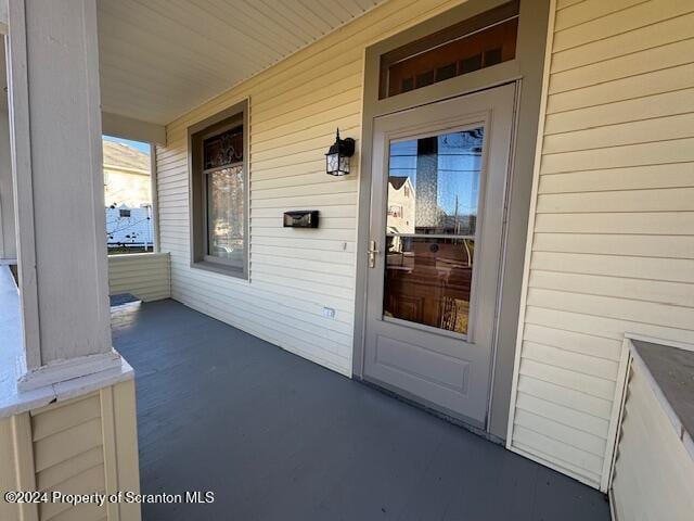 doorway to property featuring a porch