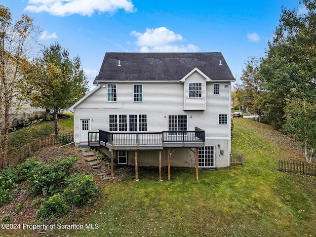 back of property with a wooden deck