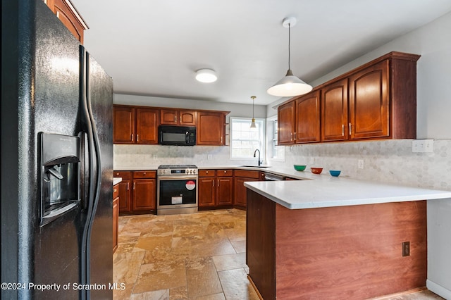 kitchen featuring sink, hanging light fixtures, kitchen peninsula, decorative backsplash, and black appliances