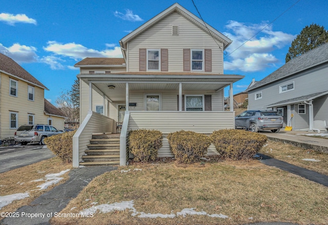 view of front of house featuring covered porch and stairway