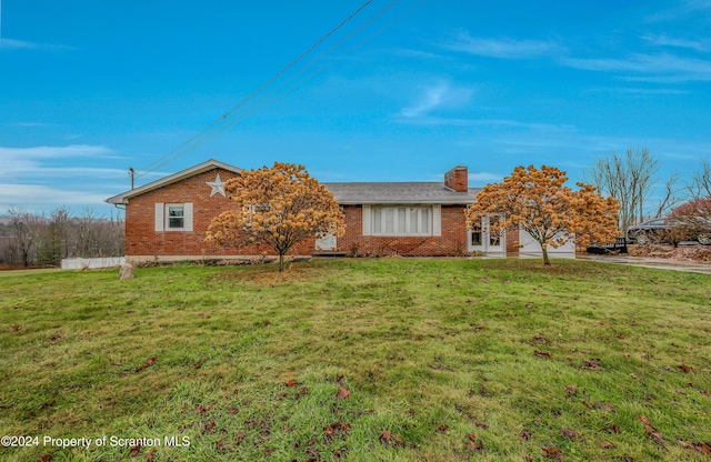 ranch-style home featuring a front yard