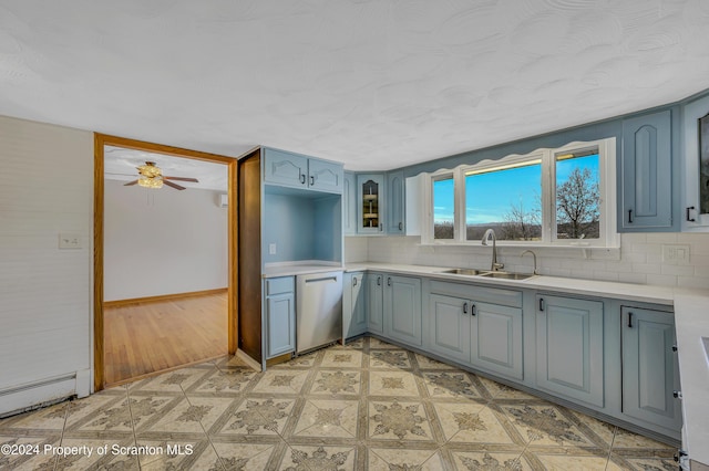 kitchen featuring backsplash, dishwasher, ceiling fan, and sink